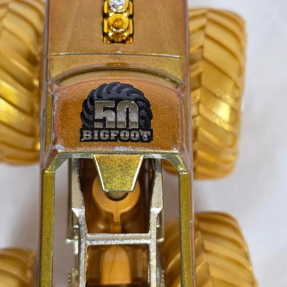 Hot Wheels Monster Trucks Bigfoot 4x4 50th Anniversary Gold 1:64 Scale Die-Cast